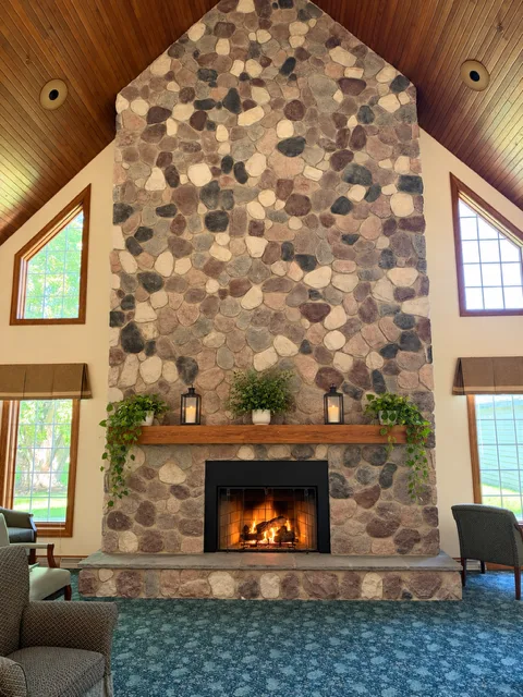 Cozy fireplace lounge at Adava Care of Hartland in Hartland, WI