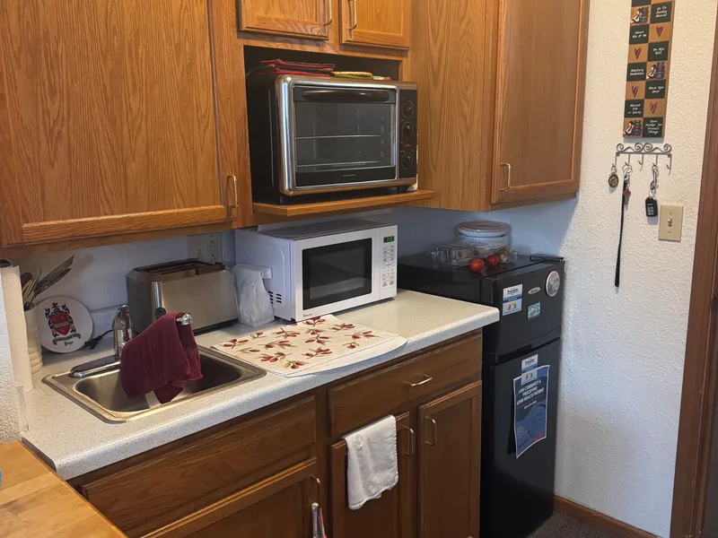 Assisted living bedroom interior at Adava Care Pewaukee in Pewaukee, WI