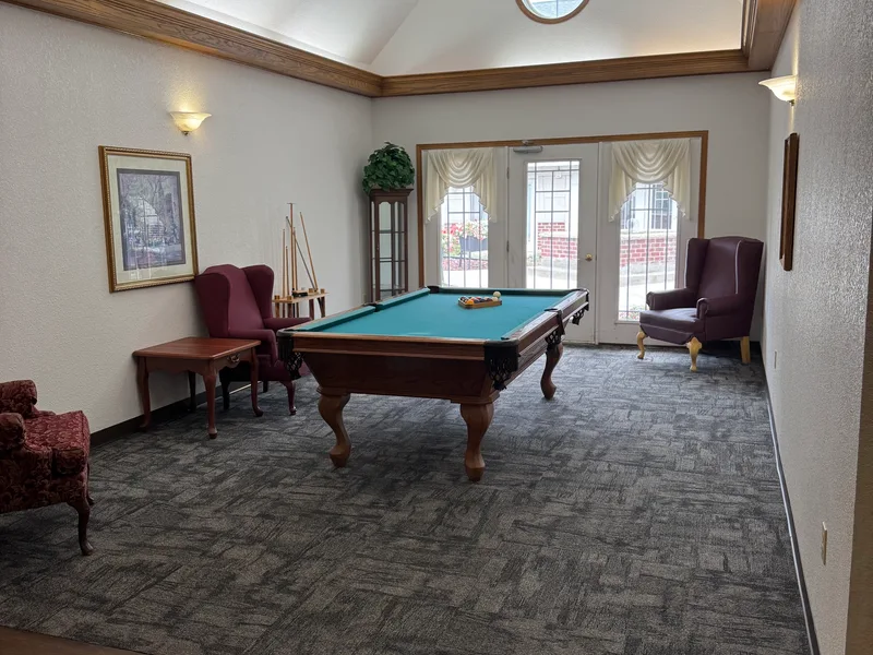 Billiards room at Adava Care Pewaukee senior living in Pewaukee, WI