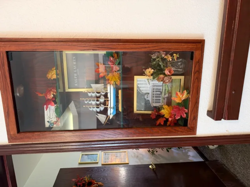 Personal shadow box display in hallway at Adava Care St. Francis in St. Francis, WI