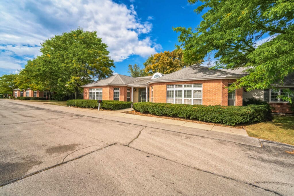 Brick building with trees and blue sky