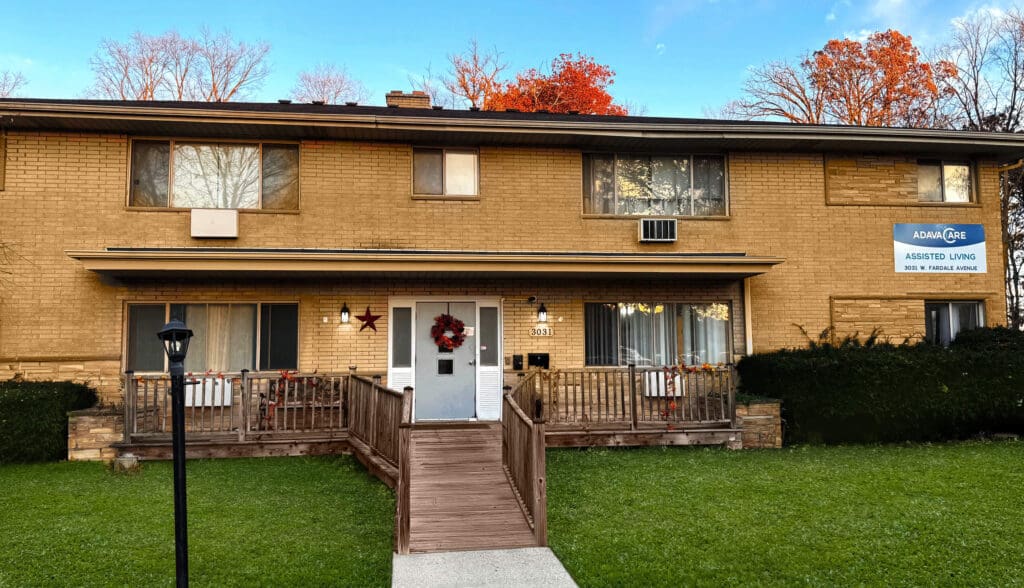 Assisted living facility with brick exterior and ramp.